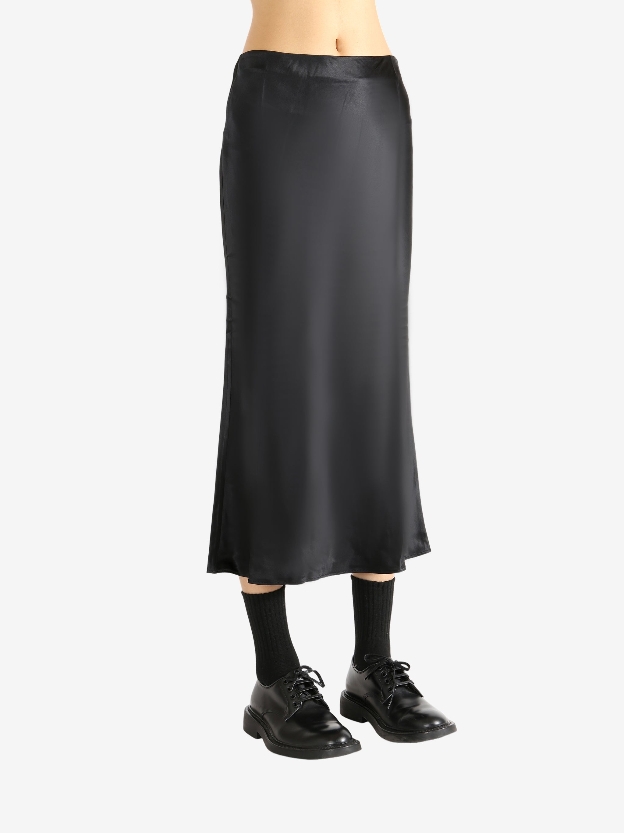 Black skirt worn by a person, showing the skirt's fit