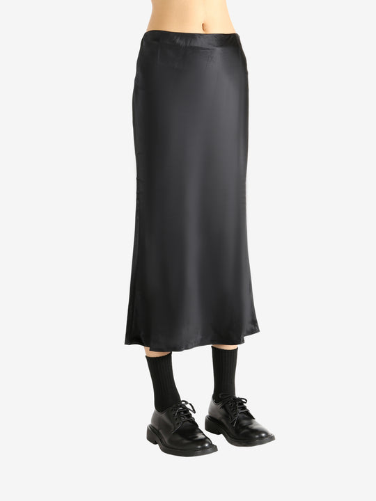 Black skirt worn by a person, showing the skirt's fit
