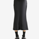 Black skirt worn by a person, showing the skirt's fit