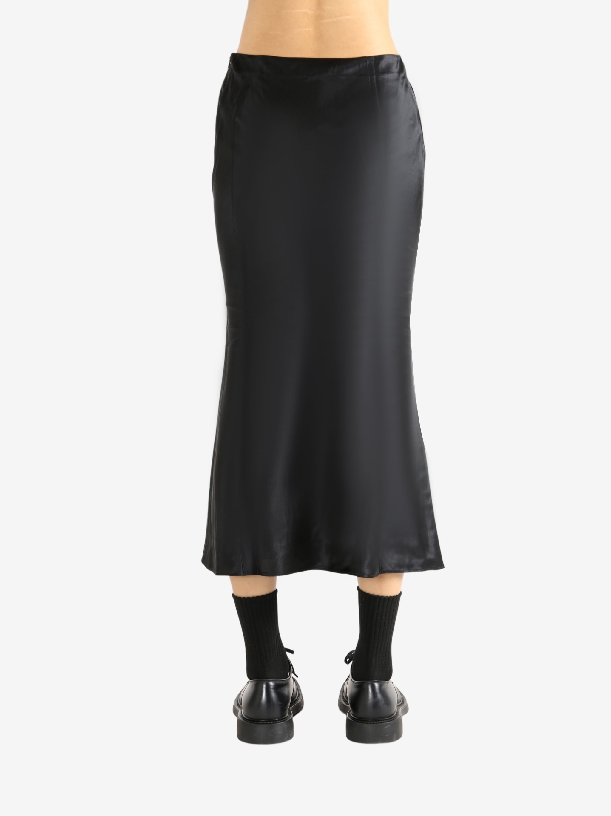Black skirt worn by a person, showing the skirt's fit