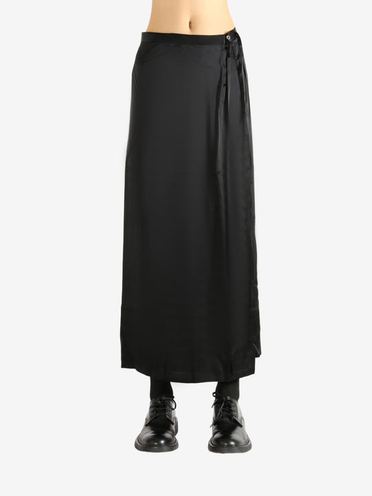 Black skirt worn by a person, showing the skirt's fit