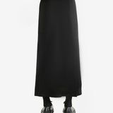 Black skirt worn by a person, showing the skirt's fit