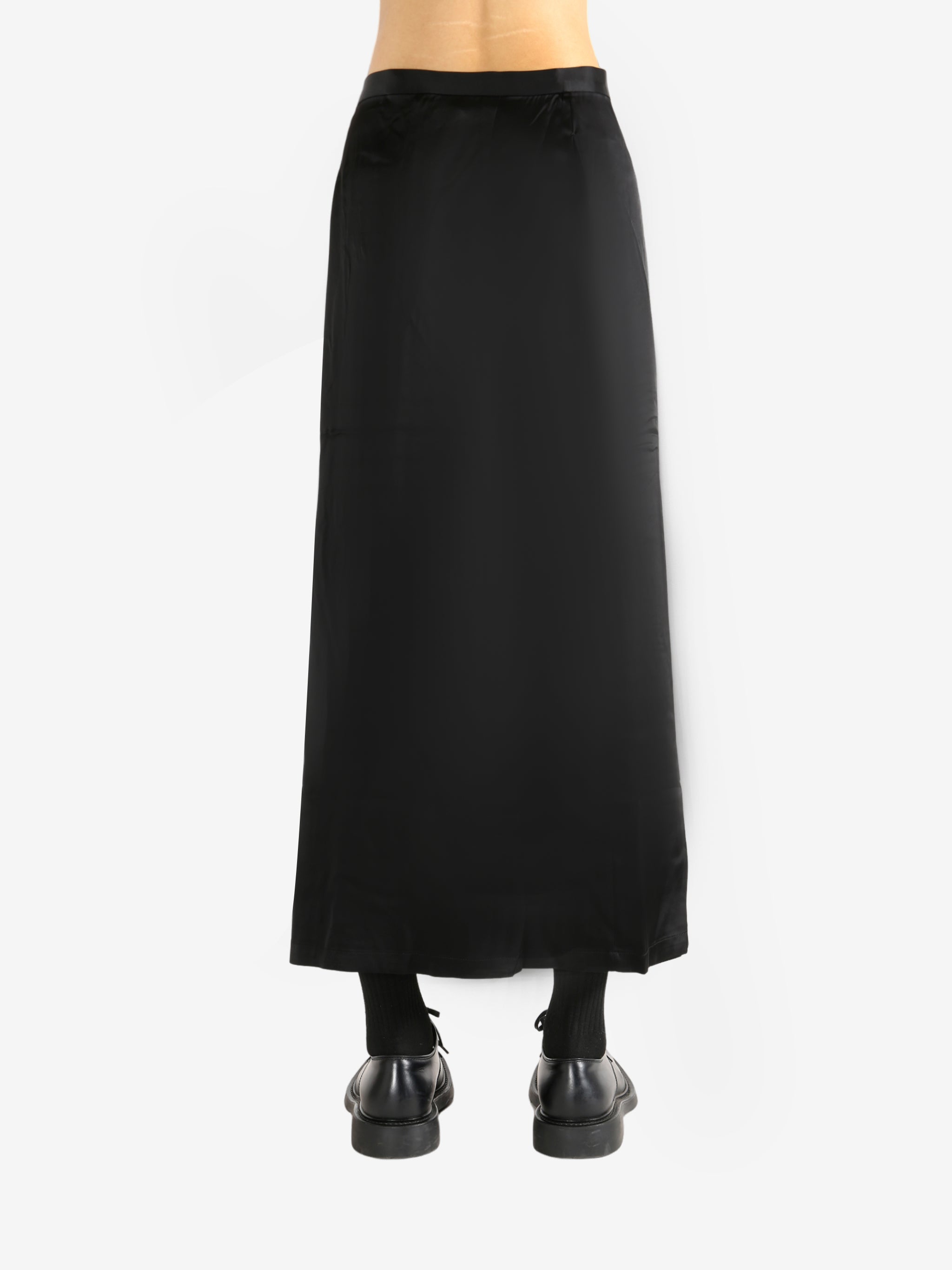 Black skirt worn by a person, showing the skirt's fit