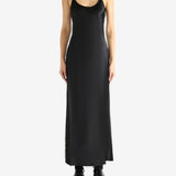 Black dress worn by a person, showing the skirt's fit