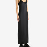 Black dress worn by a person, showing the skirt's fit