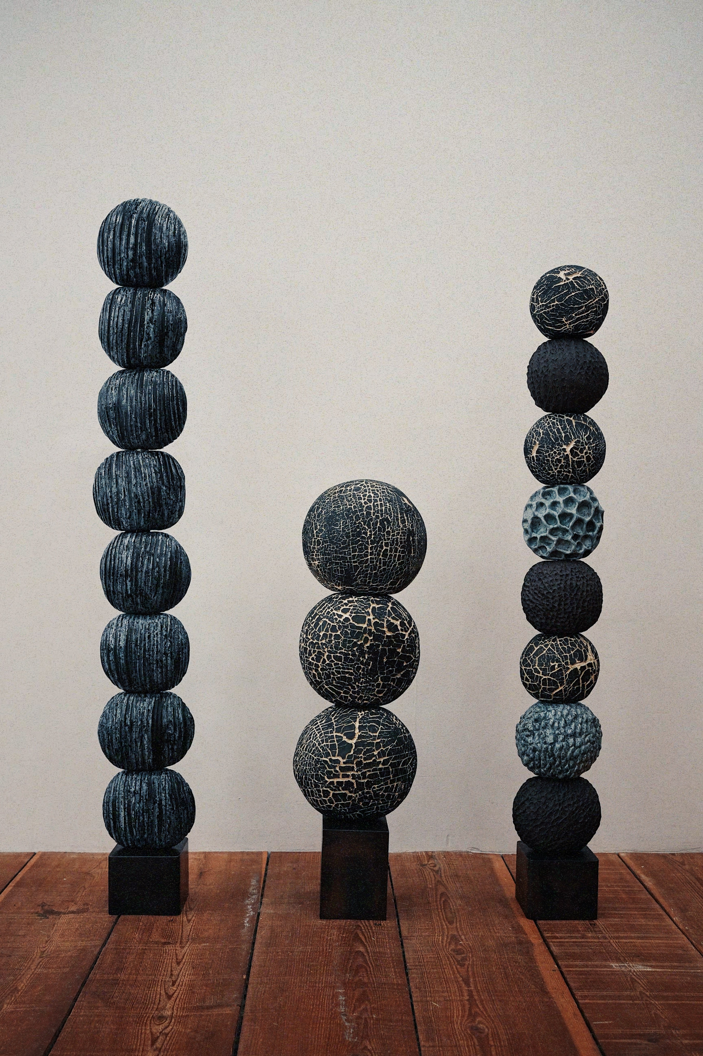 Ann Shure hand-built ceramic sculpture trio, stoneware and porcelain on blackened steel bases.