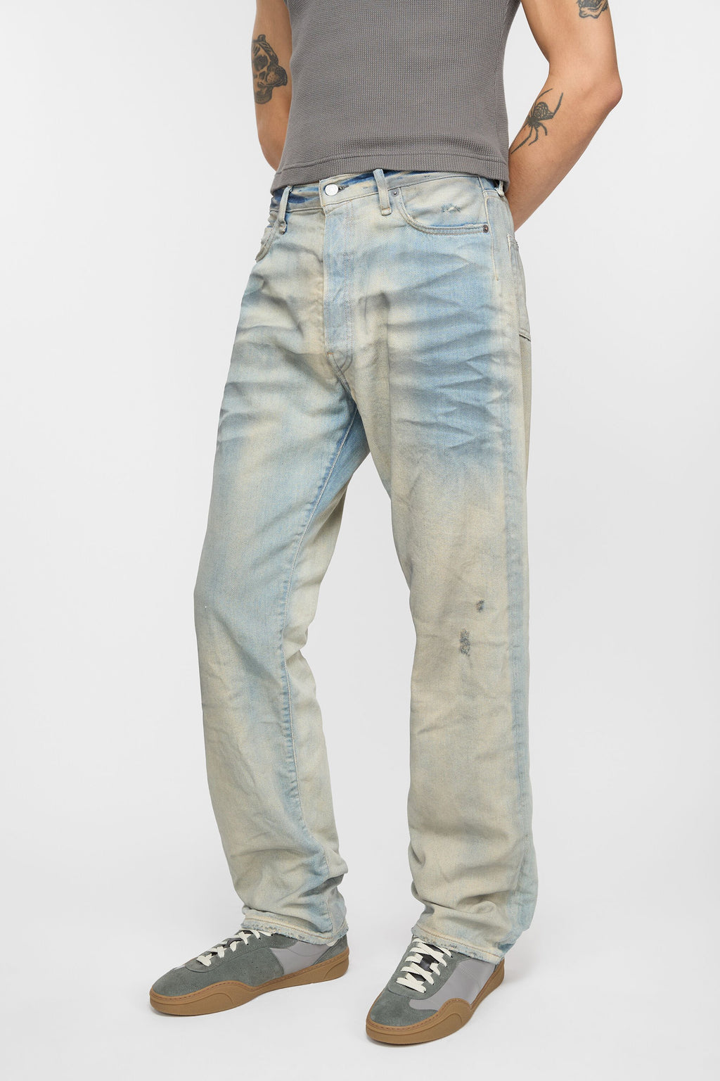 Blue jean worn by a person, showing the jean’s fit