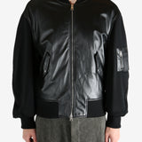 Black jacket worn by a person, showing the jacket's fit