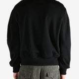 Black jacket worn by a person, showing the jacket's fit