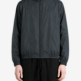 Black jacket worn by a person, showing the jacket fit