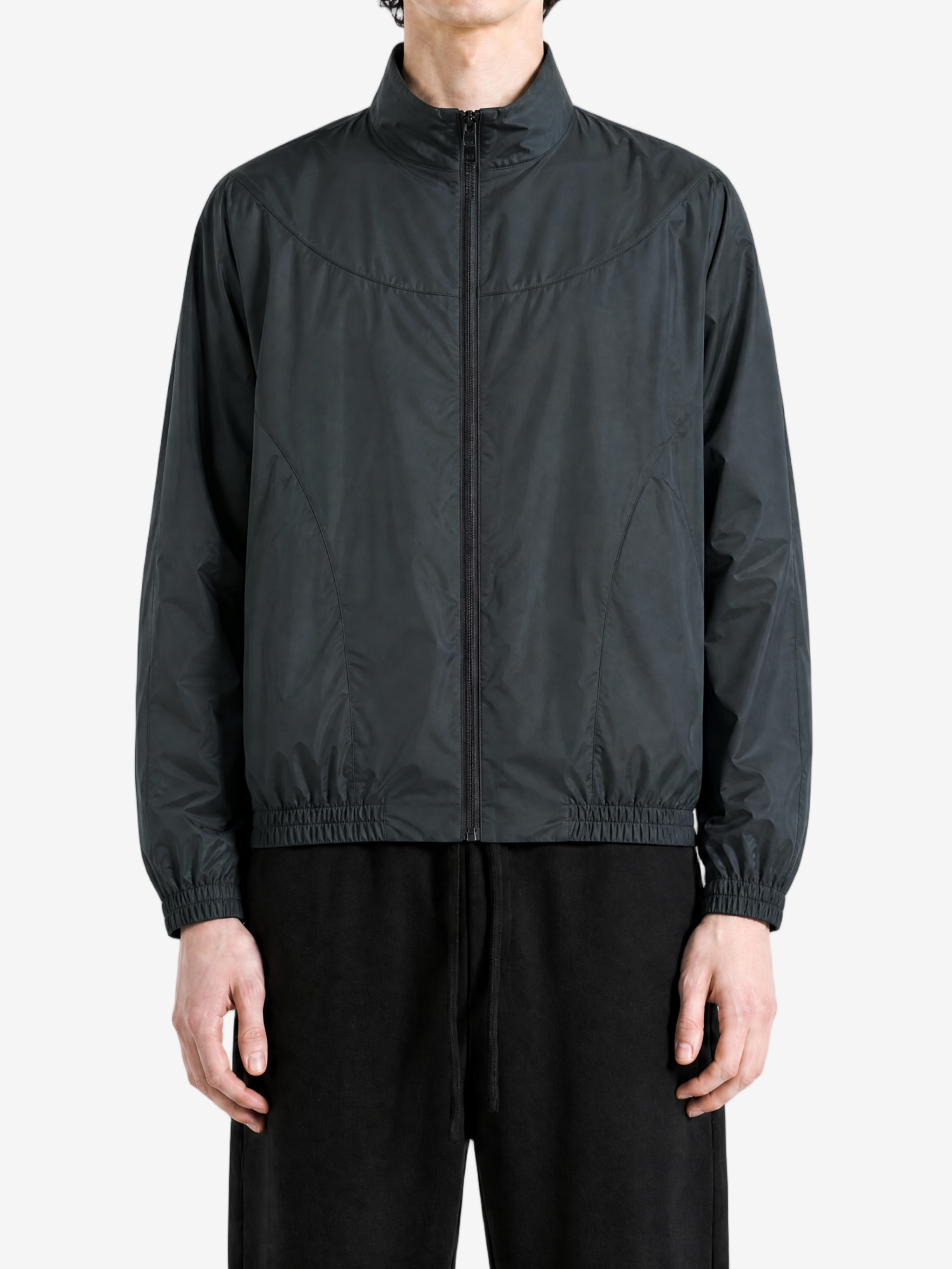 Black jacket worn by a person, showing the jacket fit