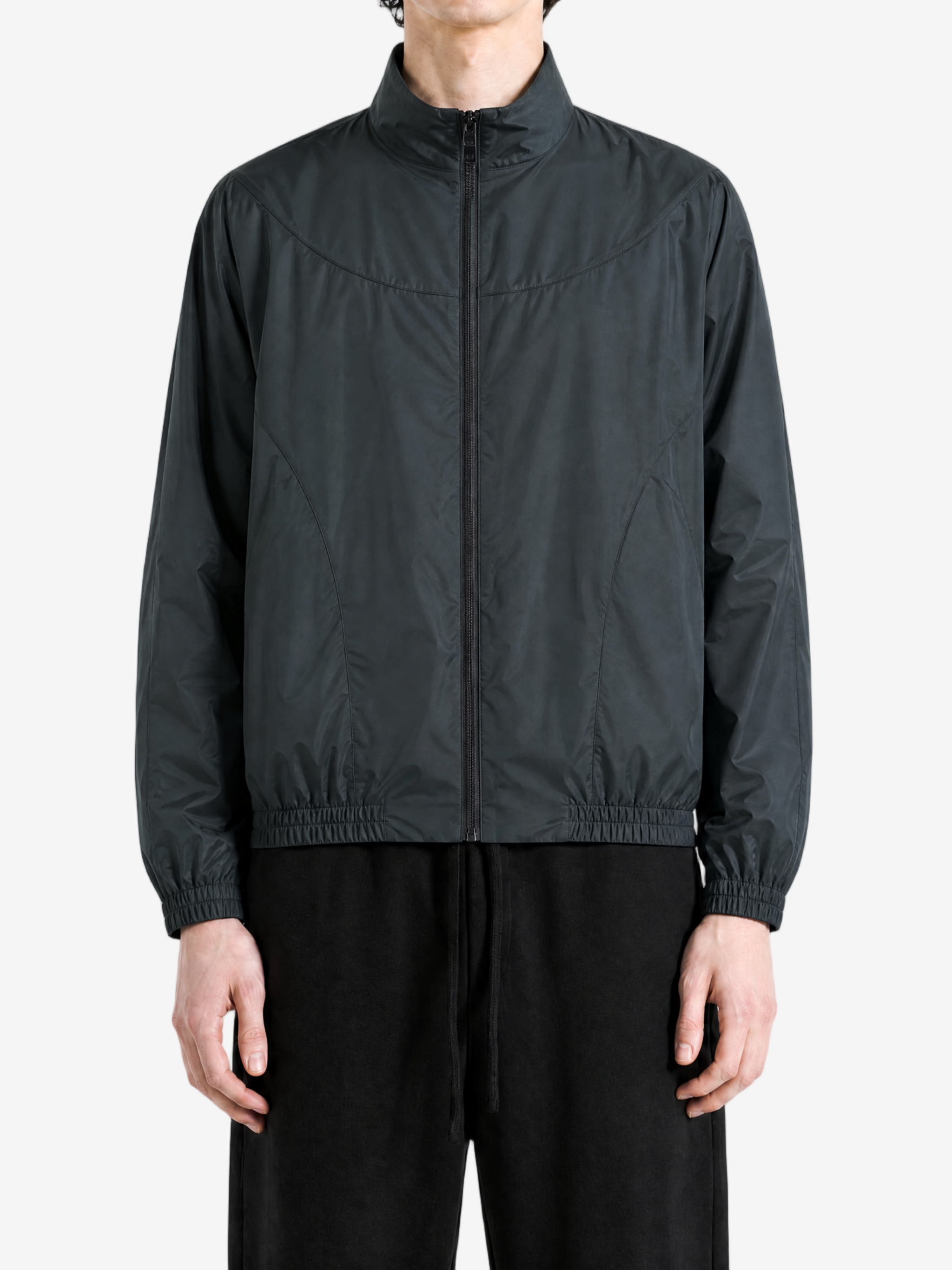 Black jacket worn by a person, showing the jacket fit