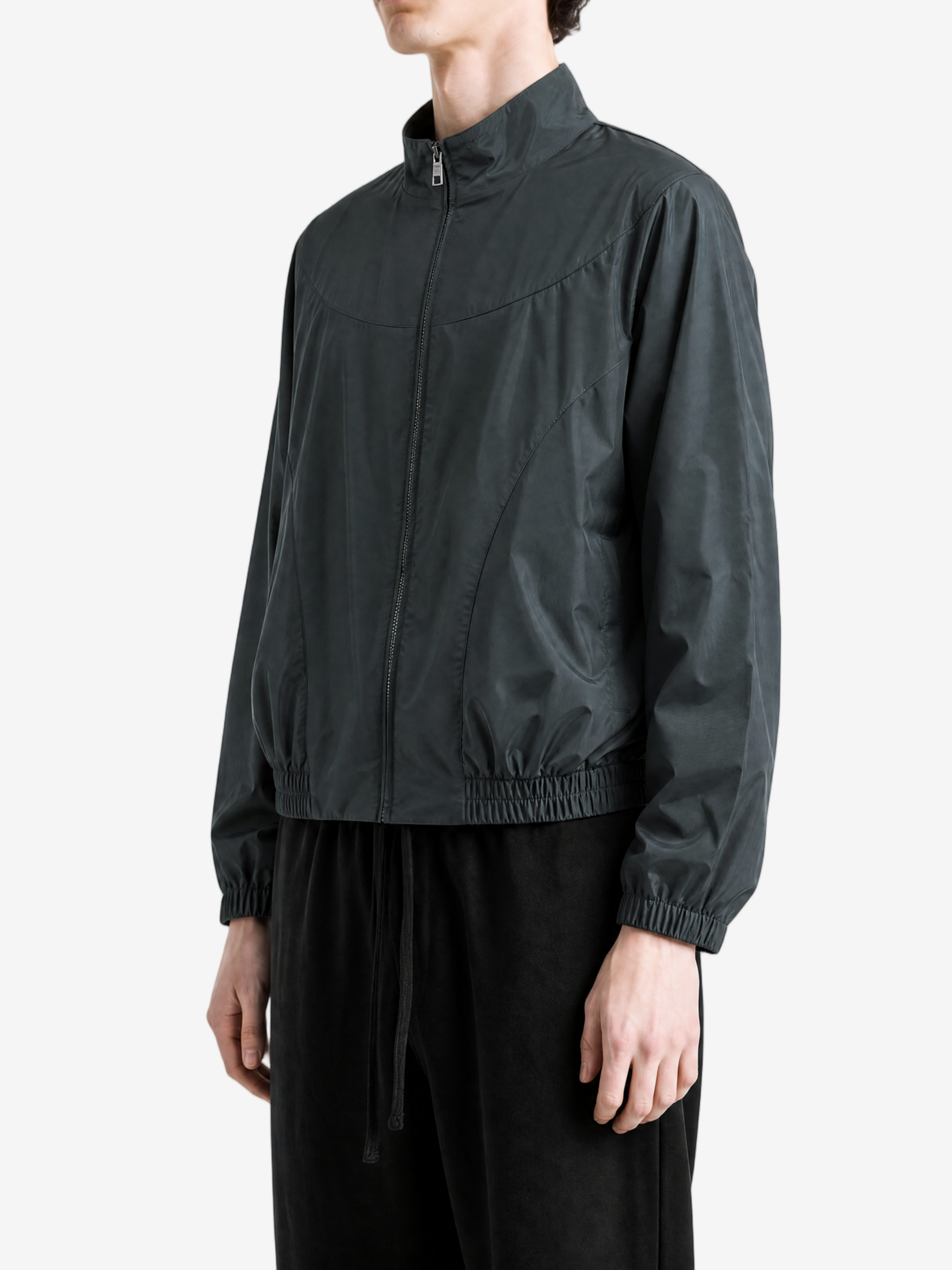 Black jacket worn by a person, side view