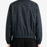 Black jacket worn by a person, back view