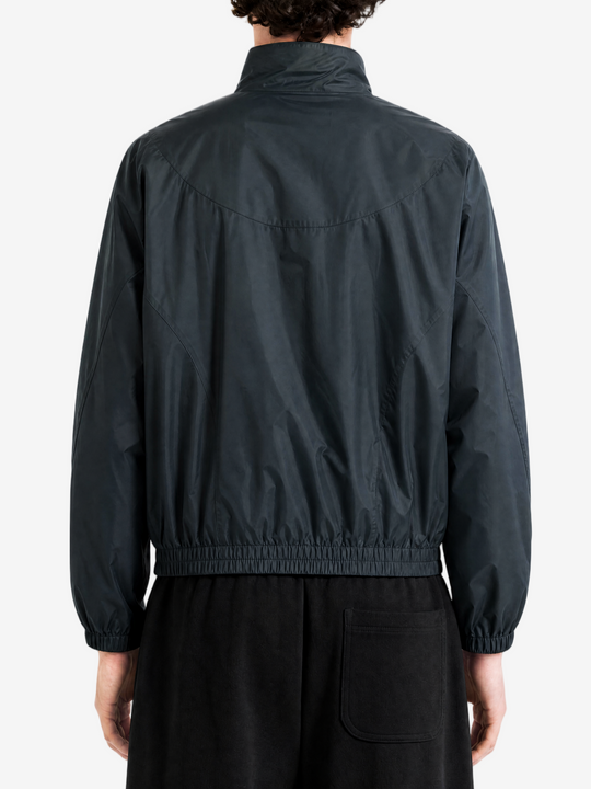 Black jacket worn by a person, back view