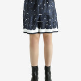 Navy shorts worn by a person, showing the shorts fit