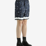 Navy shorts worn by a person, showing the shorts fit