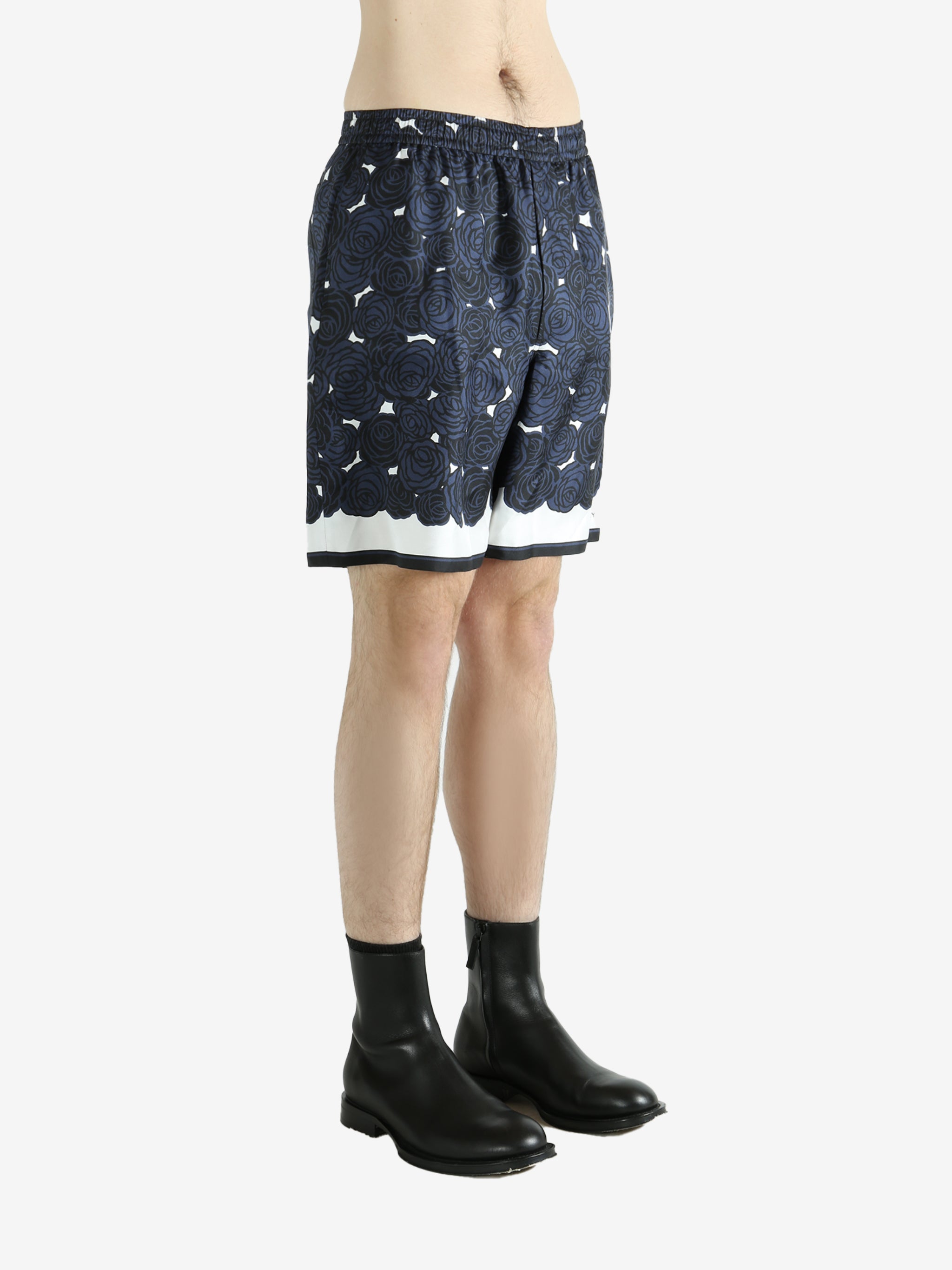 Navy shorts worn by a person, showing the shorts fit