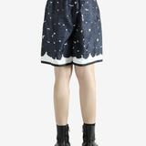 Navy shorts worn by a person, showing the shorts fit