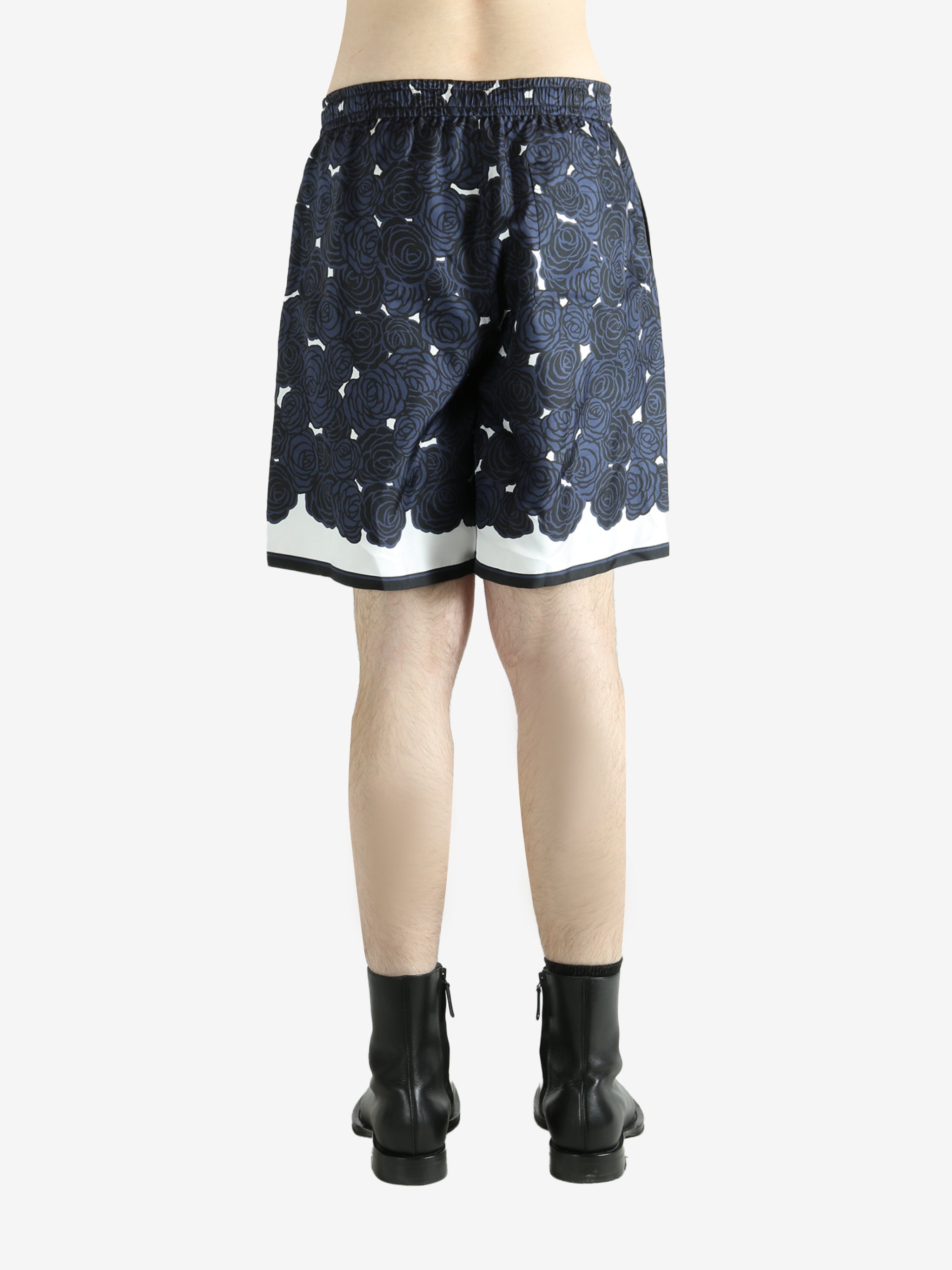 Navy shorts worn by a person, showing the shorts fit