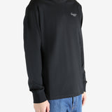 Black t-shirt worn by a person, showing the shirt's fit