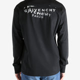 Black t-shirt worn by a person, showing the shirt's fit