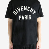 Black t-shirts worn by a person, showing the t-shirts fit