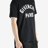 Black t-shirts worn by a person, showing the t-shirts fit