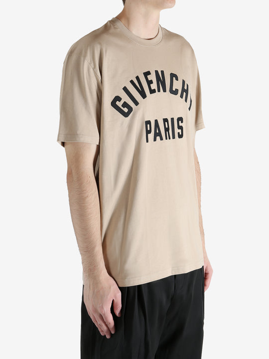 Tan t-shirts worn by a person, showing the shirt's fit