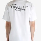 White t-shirt worn by a person, showing the t-shirt's fit