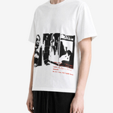 White t-shirt worn by a person, side view