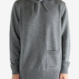 Grey hoodie worn by a person, showing the hoodie fit