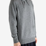 Grey hoodie worn by a person, showing the hoodie fit