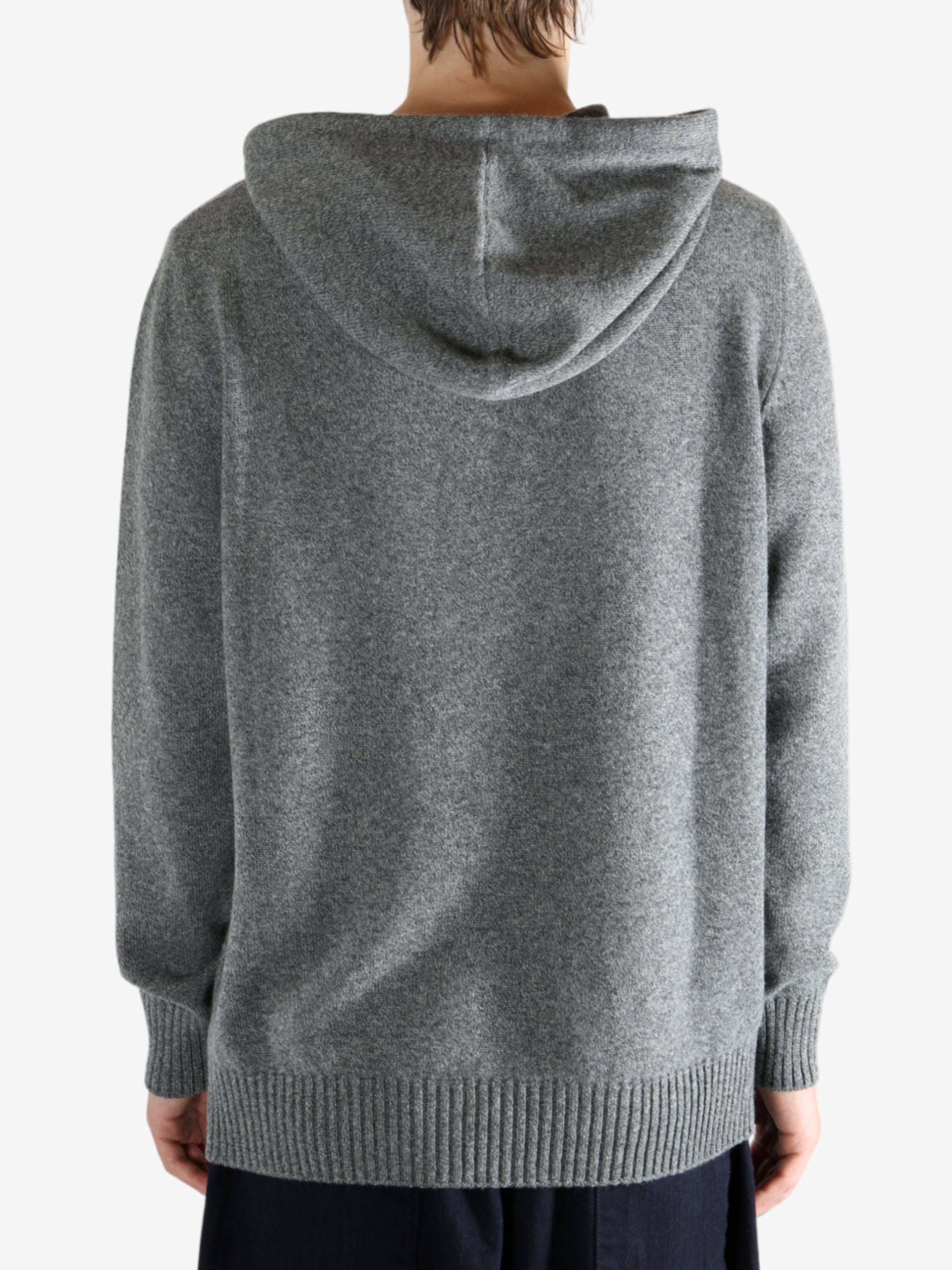 Grey hoodie worn by a person, showing the hoodie fit