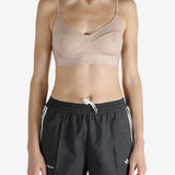 Tan top worn by a person, showing the top's fit