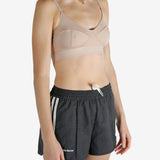 Tan top worn by a person, showing the top's fit