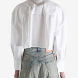 White shirt worn by a person, showing the shirt's fit