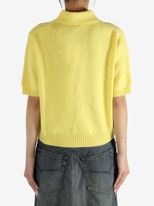 Yellow shirt worn by a person, showing the shirt's fit