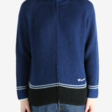 Blue sweater worn by a person, showing the sweater fit