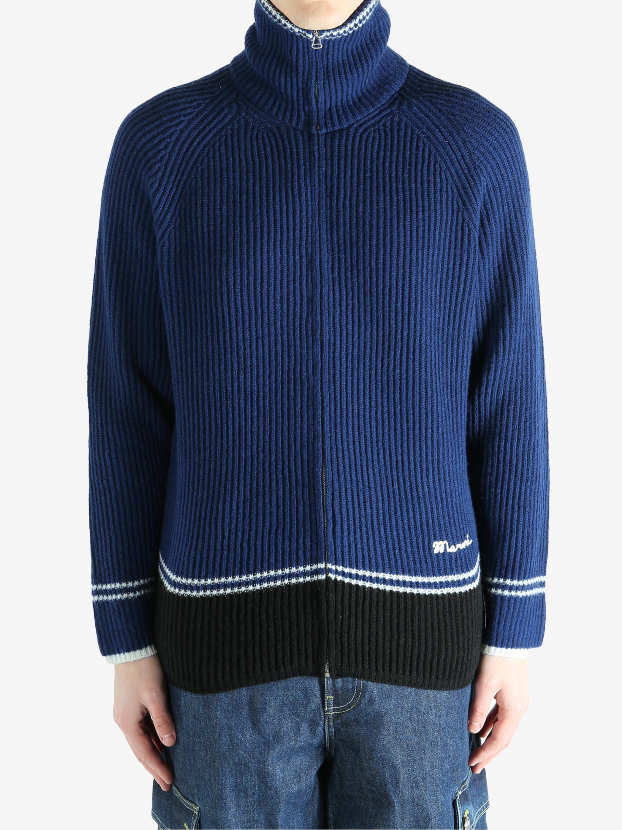 Blue sweater worn by a person, showing the sweater fit