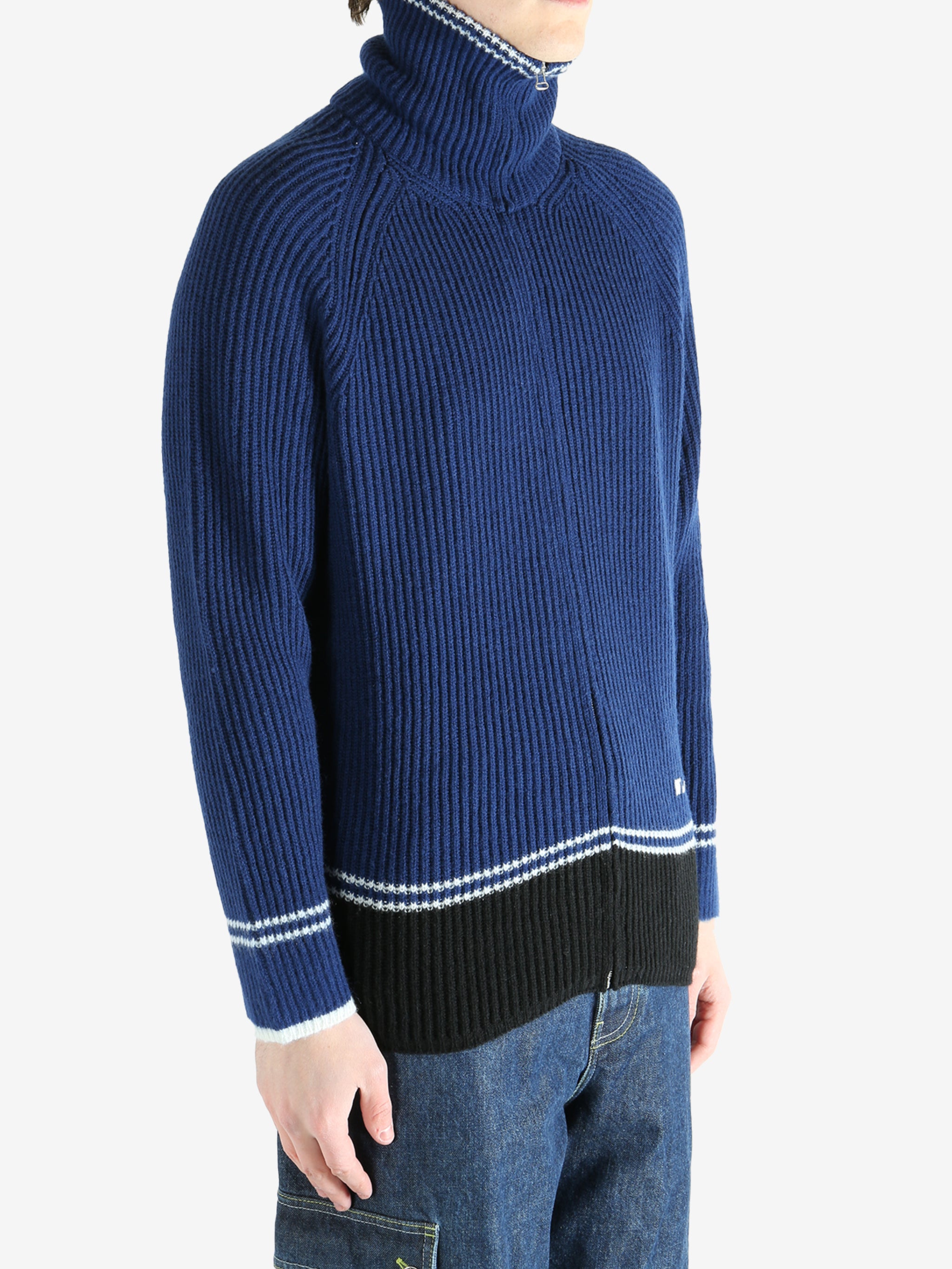 Blue sweater worn by a person, showing the sweater fit