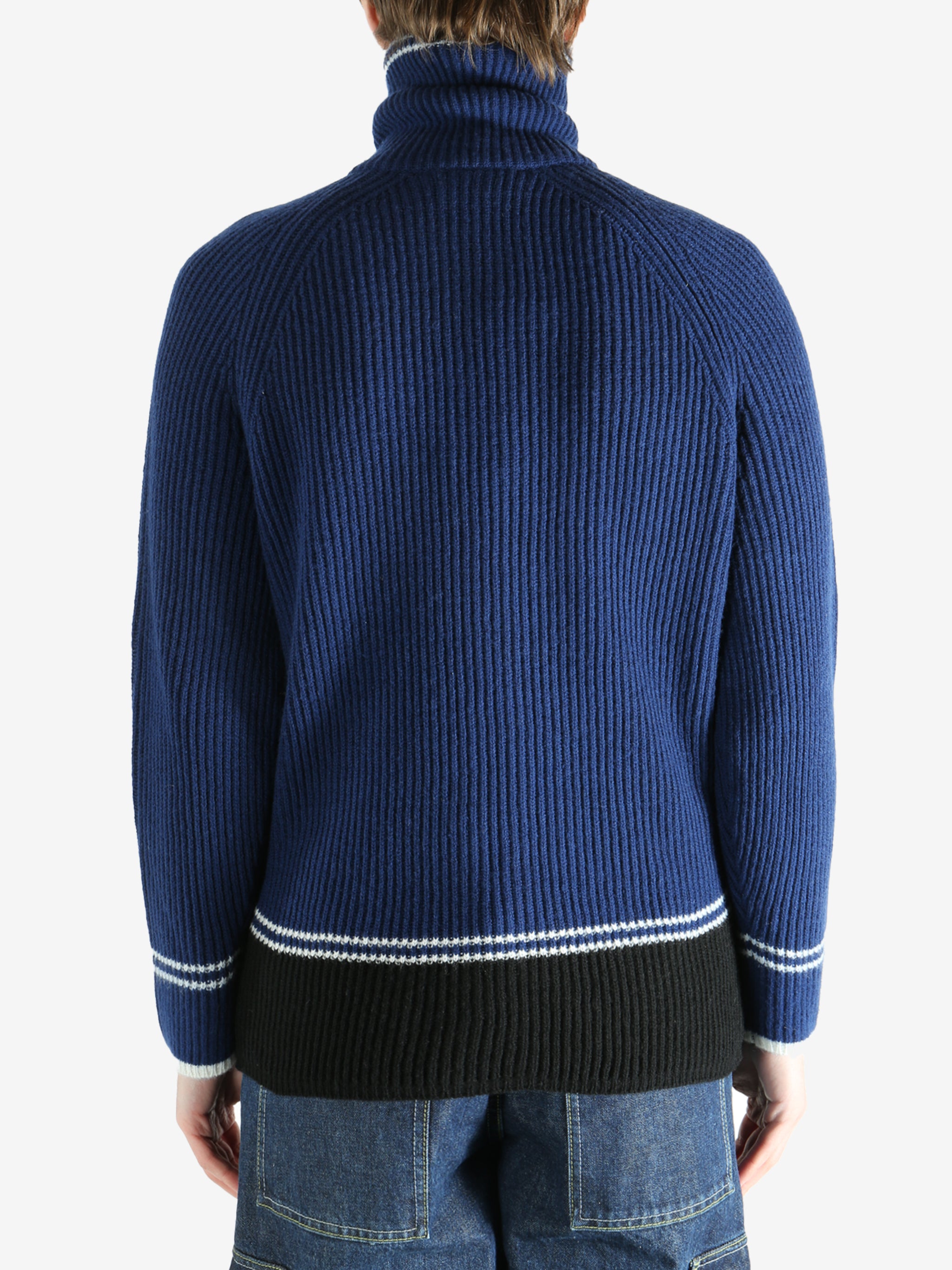 Blue sweater worn by a person, showing the sweater fit