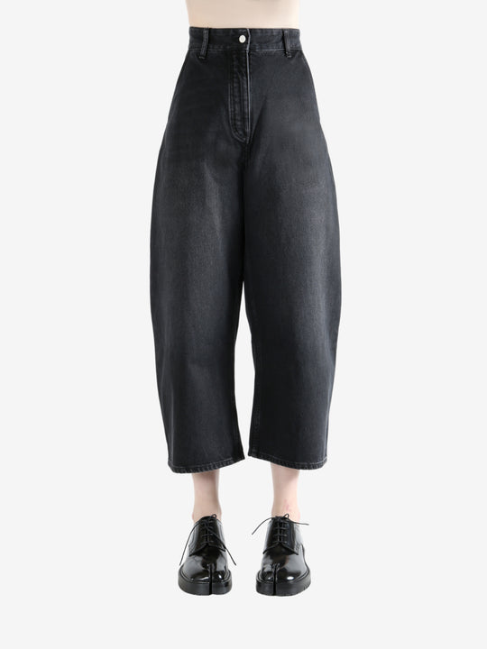 Black pants worn by a person, showing the pants fit