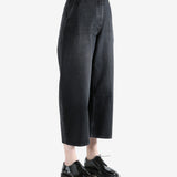 Black pants worn by a person, showing the pants fit