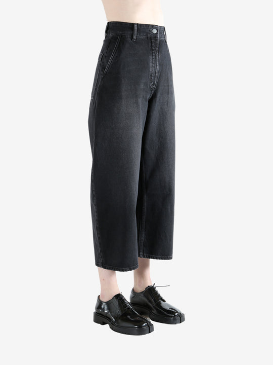 Black pants worn by a person, showing the pants fit