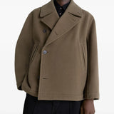 Brwon jacket worn by a person, showing the jacket fit