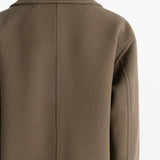 Close up of brwon jacket,showing texture of the wool fabric