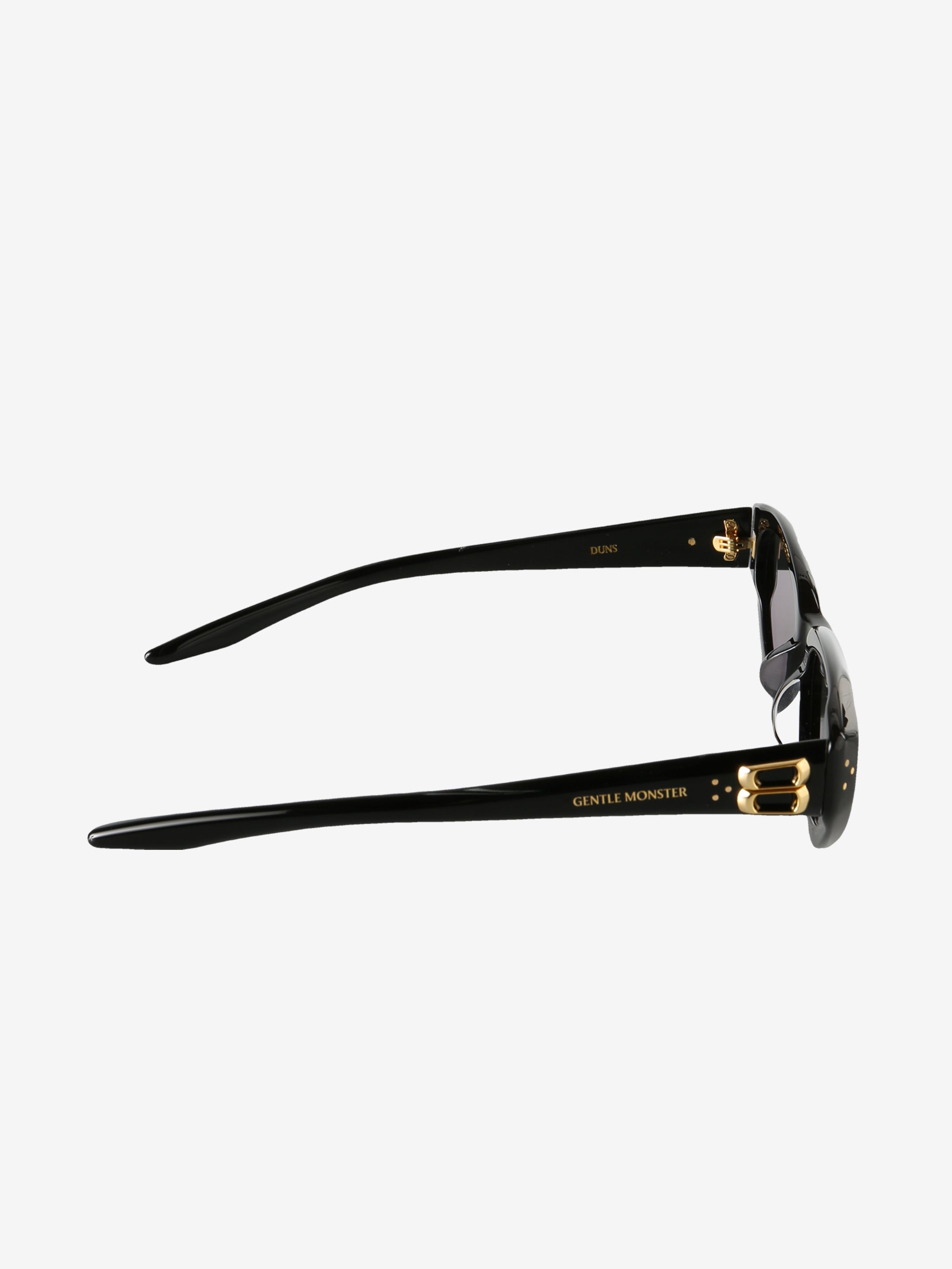 Close up of black eyewear, showing texture of the acetate fabric