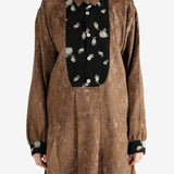 Brown shirt worn by a person, showing the shirt's fit