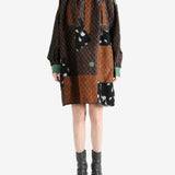 Brown tops worn by a person, showing the top fit